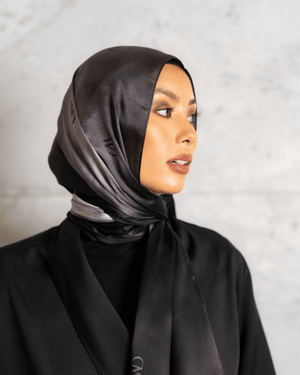 Worood Divine Noire Silk Scarf Rectangle – elegant black silk scarf with a smooth, lustrous finish - وشاح حريري مستطيل من Worood Divine Noire - وشاح حريري أسود أنيق بلمسة نهائية ناعمة ولامعة