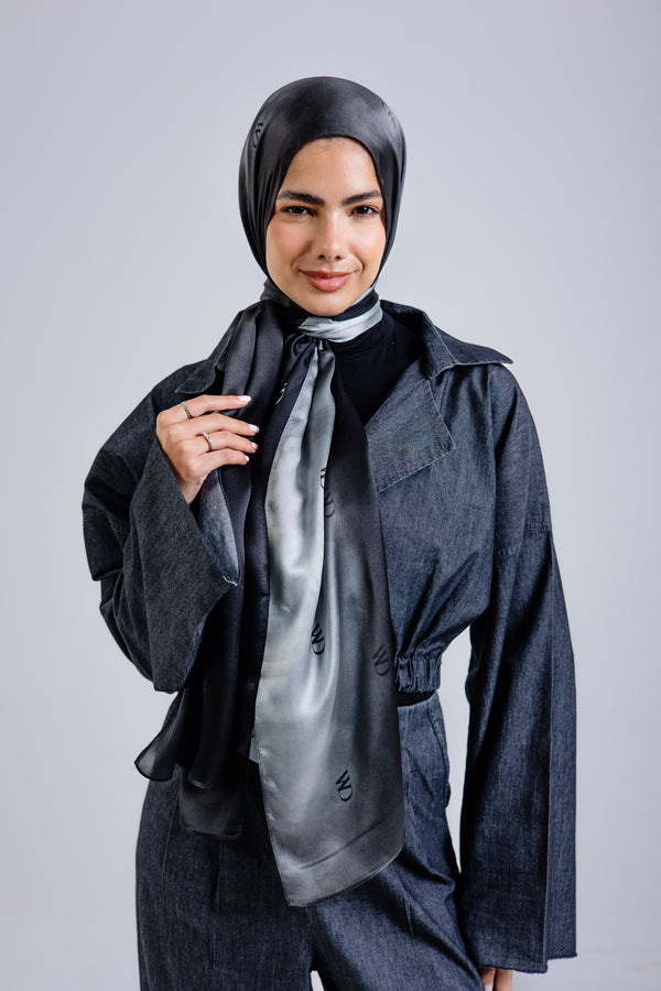 Worood Divine Noire Silk Scarf Rectangle – elegant black silk scarf with a smooth, lustrous finish - وشاح حريري مستطيل من Worood Divine Noire - وشاح حريري أسود أنيق بلمسة نهائية ناعمة ولامعة 